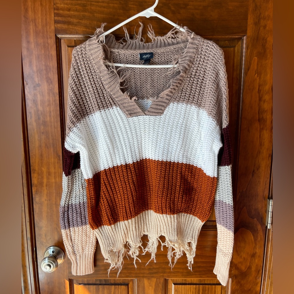 Day Trip sweater size small with fringe neckline and hem.